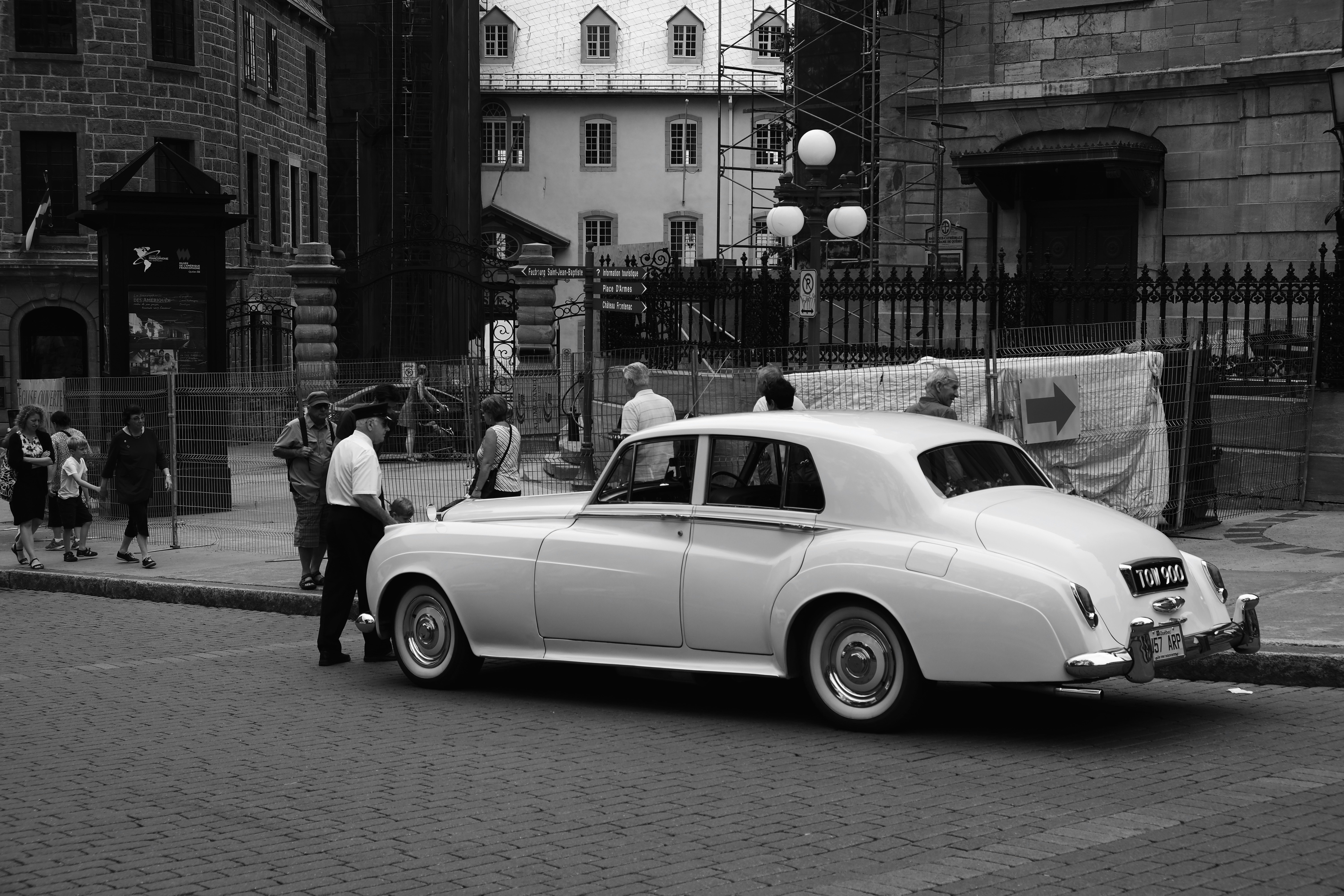 grayscale photography of vehicle on road